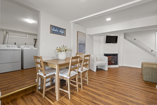 1795 Wolcott Rd, Wolcott, CT 06716 - dining space with wood finished floors, washer and clothes dryer, a fireplace, and recessed lighting