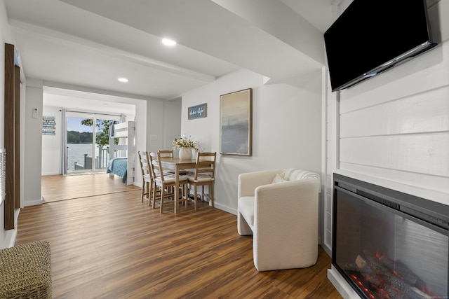 1795 Wolcott Rd, Wolcott, CT 06716 - dining space with dark wood-style floors, baseboards, recessed lighting, and a glass covered fireplace