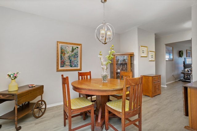 87 E Broadway Unit D, Milford, CT 06460 - dining area featuring light wood-type flooring, a chandelier, and baseboards