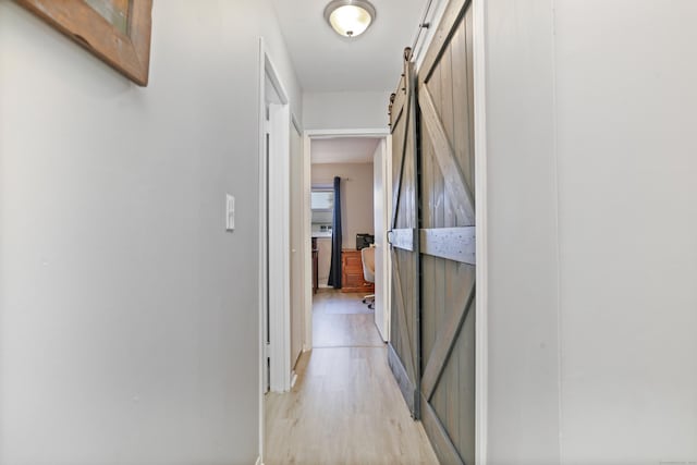 87 E Broadway Unit D, Milford, CT 06460 - hall featuring a barn door and light wood-type flooring
