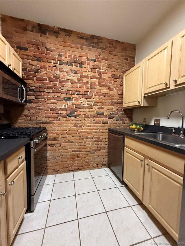 68 Morris St Unit 202, Hartford, CT 06114 - kitchen with stainless steel appliances, a sink, brick wall, and dark countertops
