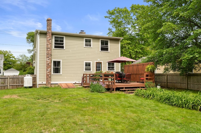 8 Maple Ave, Clinton, CT 06413 - rear view of property featuring a wooden deck and a chimney