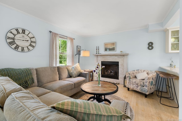 8 Maple Ave, Clinton, CT 06413 - living area with a fireplace, ornamental molding, and light wood-type flooring
