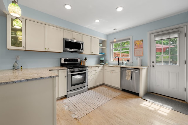 8 Maple Ave, Clinton, CT 06413 - kitchen with stainless steel appliances, a sink, light wood finished floors, pendant lighting, and recessed lighting