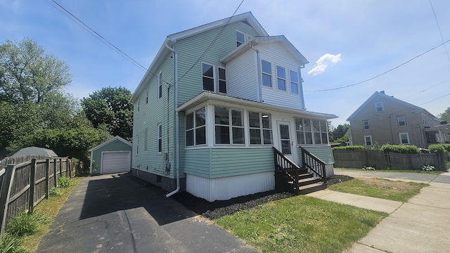 82 Windsor St, Enfield, CT 06082 - view of front of property featuring a detached garage, asphalt driveway, entry steps, and an outdoor structure