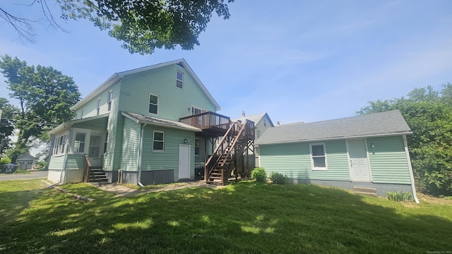 82 Windsor St, Enfield, CT 06082 - rear view of house featuring stairs, a deck, a yard, and entry steps