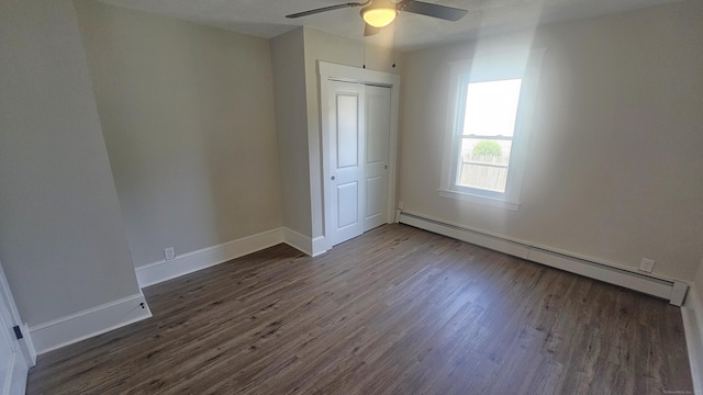 82 Windsor St, Enfield, CT 06082 - unfurnished bedroom with a baseboard radiator, dark wood finished floors, a closet, baseboards, and a ceiling fan