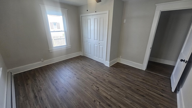 82 Windsor St, Enfield, CT 06082 - unfurnished bedroom with dark wood finished floors, baseboards, and a closet