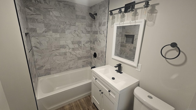82 Windsor St, Enfield, CT 06082 - full bath with vanity,  shower combination, toilet, and wood finished floors