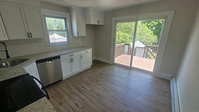 82 Windsor St, Enfield, CT 06082 - kitchen with dishwasher, a sink, wood finished floors, white cabinets, and baseboards