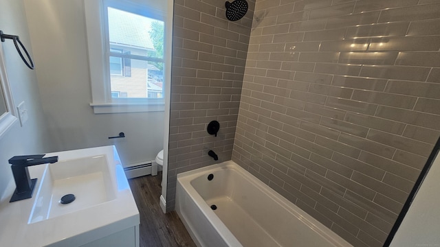 82 Windsor St, Enfield, CT 06082 - bathroom featuring wood finished floors, toilet, vanity, tub / shower combination, and a baseboard heating unit
