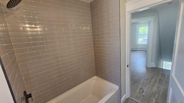 82 Windsor St, Enfield, CT 06082 - bathroom featuring wood finished floors, shower / bath combination, baseboard heating, and baseboards