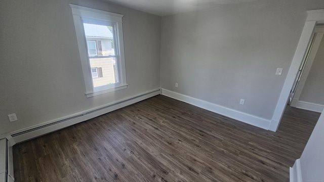 82 Windsor St, Enfield, CT 06082 - empty room featuring dark wood-type flooring, baseboards, and baseboard heating