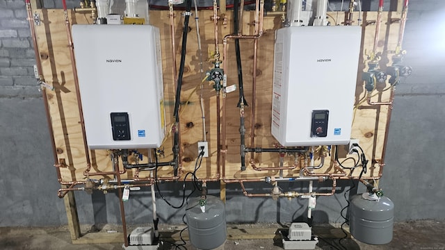 82 Windsor St, Enfield, CT 06082 - utility room featuring tankless water heater