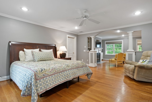 36 Fox Mdw, Marlborough, CT 06447 - bedroom featuring light wood-style floors, decorative columns, a fireplace, baseboards, and ornamental molding