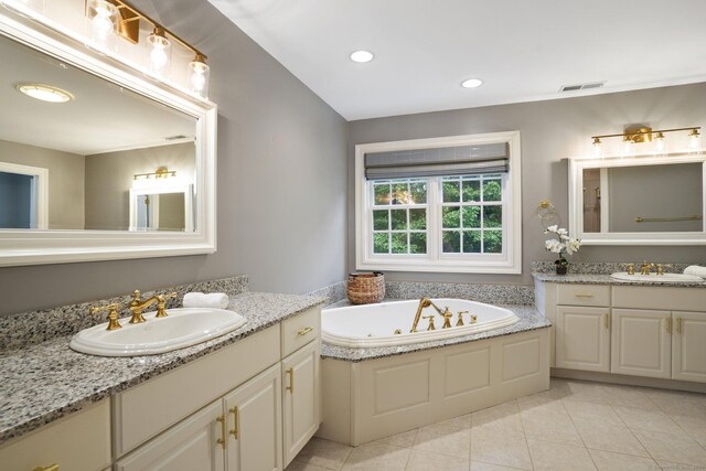 36 Fox Mdw, Marlborough, CT 06447 - bathroom with two vanities, a whirlpool tub, tile patterned flooring, and recessed lighting