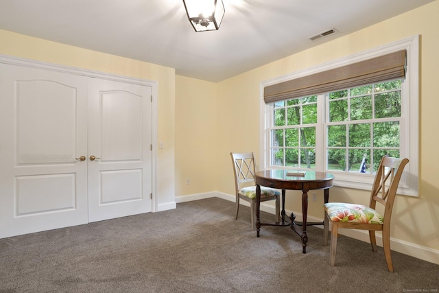 36 Fox Mdw, Marlborough, CT 06447 - dining room with dark colored carpet and baseboards