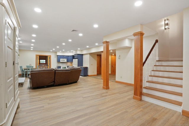 36 Fox Mdw, Marlborough, CT 06447 - living area with light wood finished floors, recessed lighting, stairs, baseboards, and ornate columns
