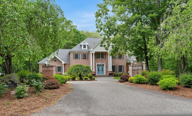 36 Fox Mdw, Marlborough, CT 06447 - neoclassical home featuring brick siding, asphalt driveway, and french doors
