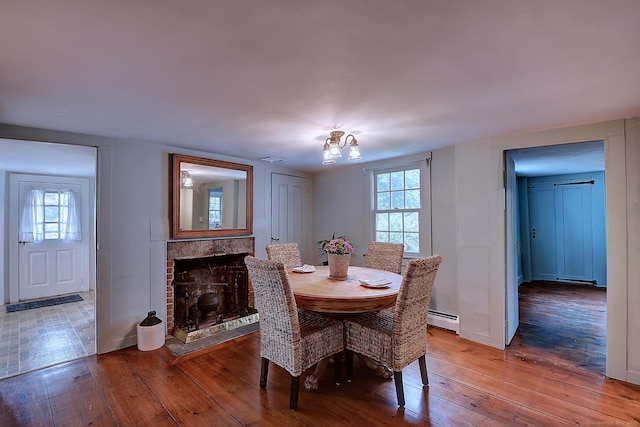 34 N Main St, Marlborough, CT 06447 - dining room featuring a baseboard heating unit, hardwood / wood-style flooring, and healthy amount of natural light