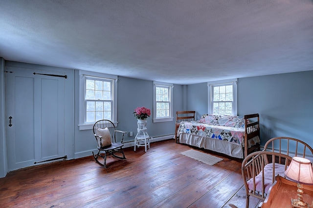 34 N Main St, Marlborough, CT 06447 - bedroom with hardwood / wood-style floors, a textured ceiling, and a baseboard heating unit
