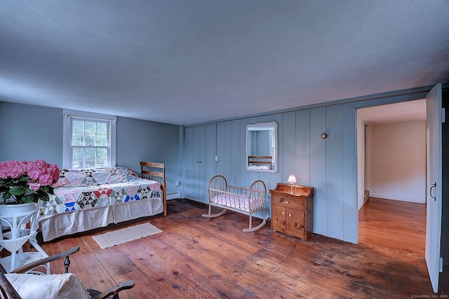 34 N Main St, Marlborough, CT 06447 - bedroom with a baseboard heating unit and wood-type flooring