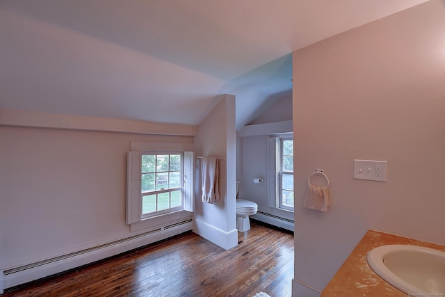 34 N Main St, Marlborough, CT 06447 - bathroom featuring a baseboard heating unit, toilet, wood finished floors, lofted ceiling, and plenty of natural light
