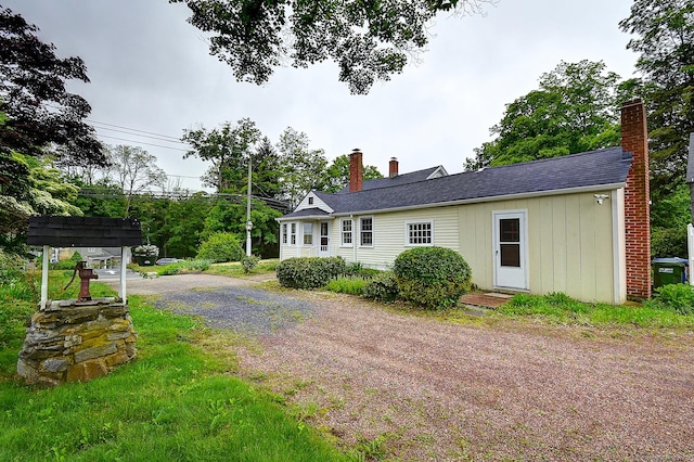 34 N Main St, Marlborough, CT 06447 - view of home's exterior with a chimney and dirt driveway