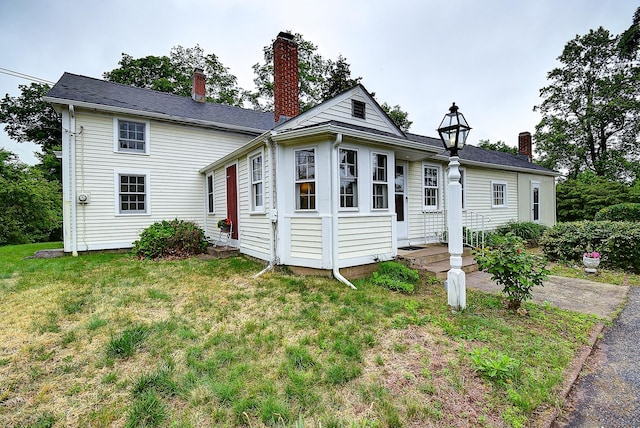 34 N Main St, Marlborough, CT 06447 - view of front facade featuring a front yard and a chimney