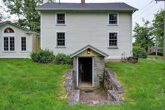 34 N Main St, Marlborough, CT 06447 - back of property with a yard, a chimney, and stone siding
