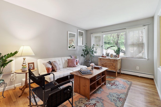 17 Linden St, Norwalk, CT 06851 - living area featuring a baseboard radiator, wood finished floors, and baseboards