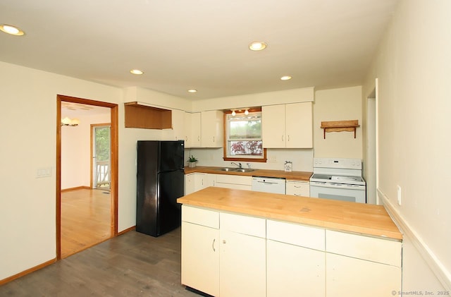 65 Bayberry Dr, Wallingford, CT 06492 - kitchen with white appliances, dark wood-style flooring, butcher block countertops, a sink, and white cabinets