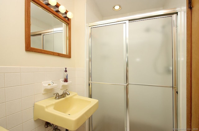 65 Bayberry Dr, Wallingford, CT 06492 - full bathroom with a sink, tile walls, an enclosed shower, recessed lighting, and wainscoting