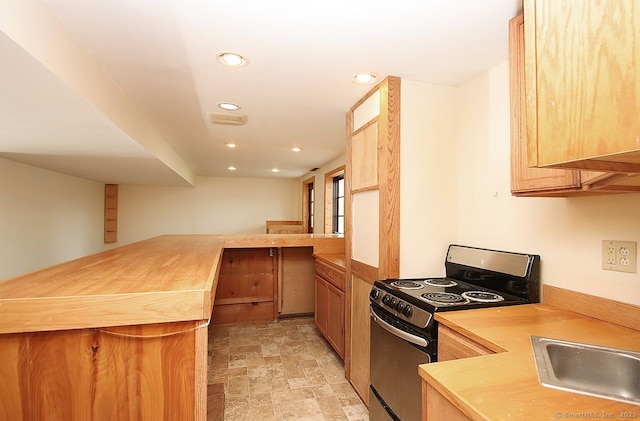 65 Bayberry Dr, Wallingford, CT 06492 - kitchen featuring range with electric cooktop, recessed lighting, stone finish flooring, a sink, and butcher block countertops