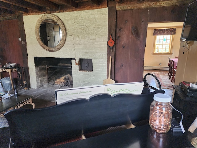 310 S Bigelow Rd, Hampton, CT 06247 - living room featuring a baseboard heating unit, a fireplace, beam ceiling, and wooden walls