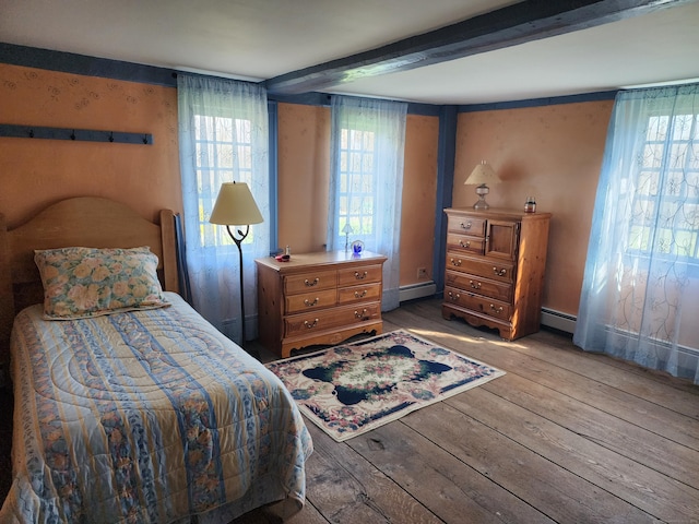 310 S Bigelow Rd, Hampton, CT 06247 - bedroom with wood-type flooring, a baseboard heating unit, and beamed ceiling