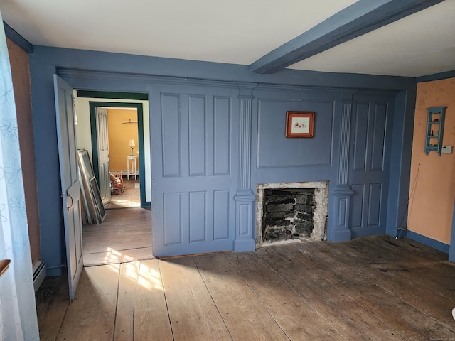 310 S Bigelow Rd, Hampton, CT 06247 - unfurnished living room featuring hardwood / wood-style floors, a fireplace, a baseboard heating unit, and beamed ceiling
