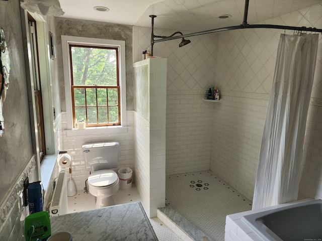 310 S Bigelow Rd, Hampton, CT 06247 - bathroom featuring tiled shower, tile walls, and tile patterned flooring