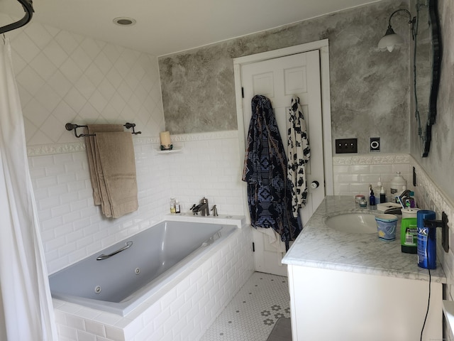 310 S Bigelow Rd, Hampton, CT 06247 - bathroom featuring a whirlpool tub, tile walls, vanity, and tile patterned flooring