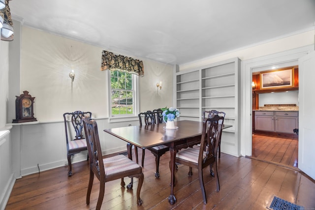 6 Landing Hill Rd, East Haddam, CT 06423 - dining area with dark wood finished floors, crown molding, and built in features