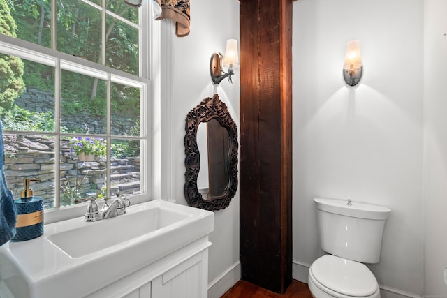 6 Landing Hill Rd, East Haddam, CT 06423 - bathroom with toilet, wood finished floors, and baseboards