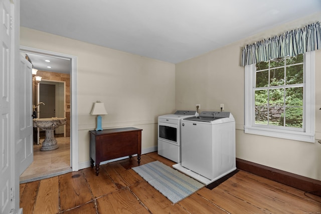 6 Landing Hill Rd, East Haddam, CT 06423 - laundry room with washing machine and clothes dryer, light wood-style flooring, and baseboards
