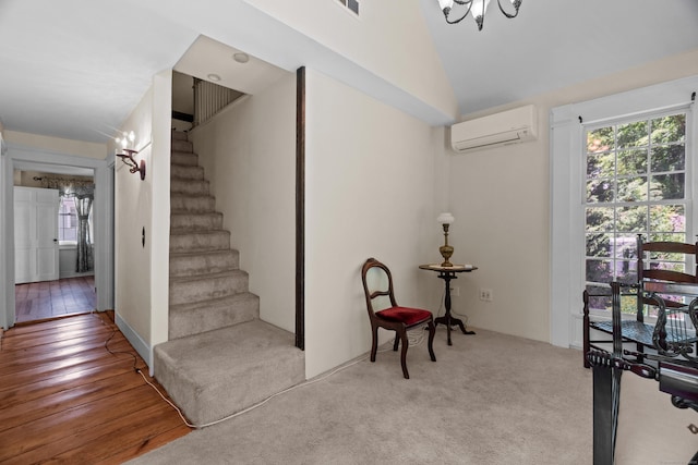 6 Landing Hill Rd, East Haddam, CT 06423 - stairs with a wall mounted air conditioner, vaulted ceiling, a chandelier, and wood finished floors