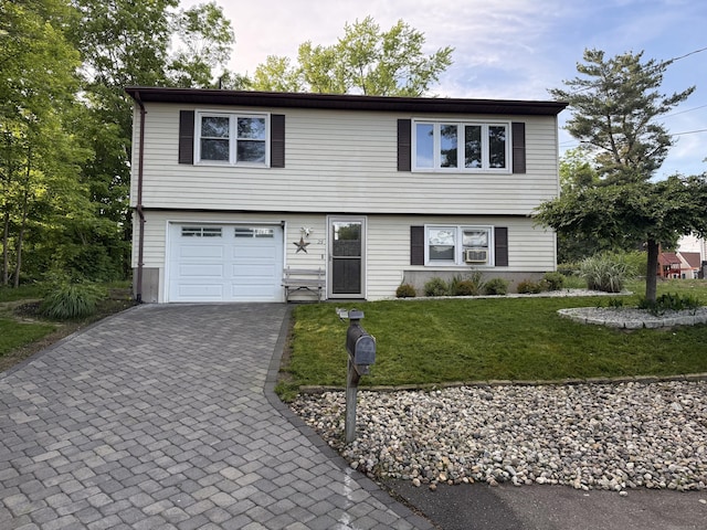 25 Parkwood Ave, Waterbury, CT 06708 - view of front facade with decorative driveway, an attached garage, a front lawn, and cooling unit