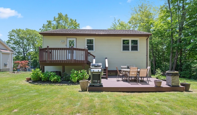 25 Parkwood Ave, Waterbury, CT 06708 - rear view of property featuring a deck, a lawn, and outdoor dining space
