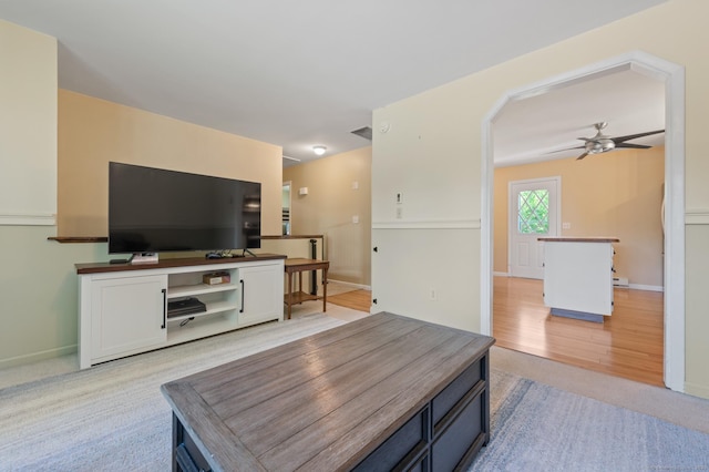25 Parkwood Ave, Waterbury, CT 06708 - living area with a ceiling fan, light colored carpet, and arched walkways