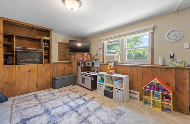 25 Parkwood Ave, Waterbury, CT 06708 - playroom featuring cooling unit, carpet floors, wooden walls, a wainscoted wall, and baseboard heating