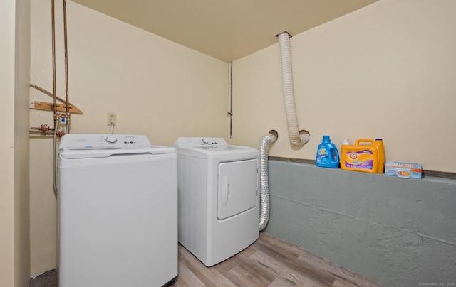 25 Parkwood Ave, Waterbury, CT 06708 - washroom featuring washer and clothes dryer and light wood finished floors