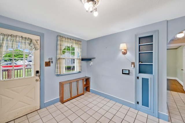 151 Mckee St, Manchester, CT 06040 - entrance foyer featuring arched walkways, baseboards, and radiator heating unit