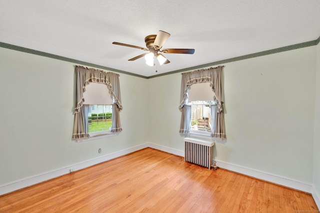 151 Mckee St, Manchester, CT 06040 - unfurnished room featuring radiator heating unit, hardwood / wood-style floors, a ceiling fan, baseboards, and ornamental molding
